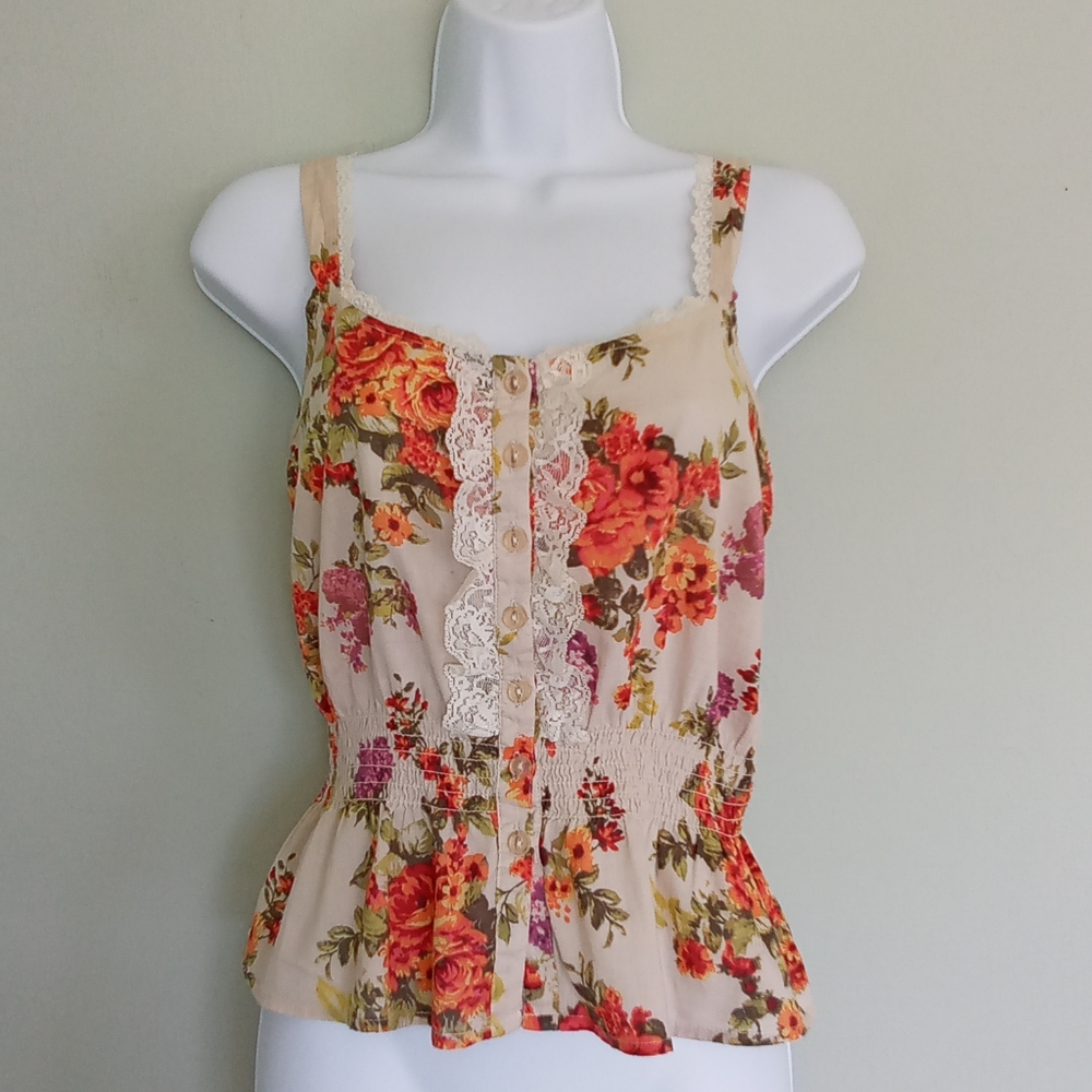 Beige and floral peplum top with lace detail